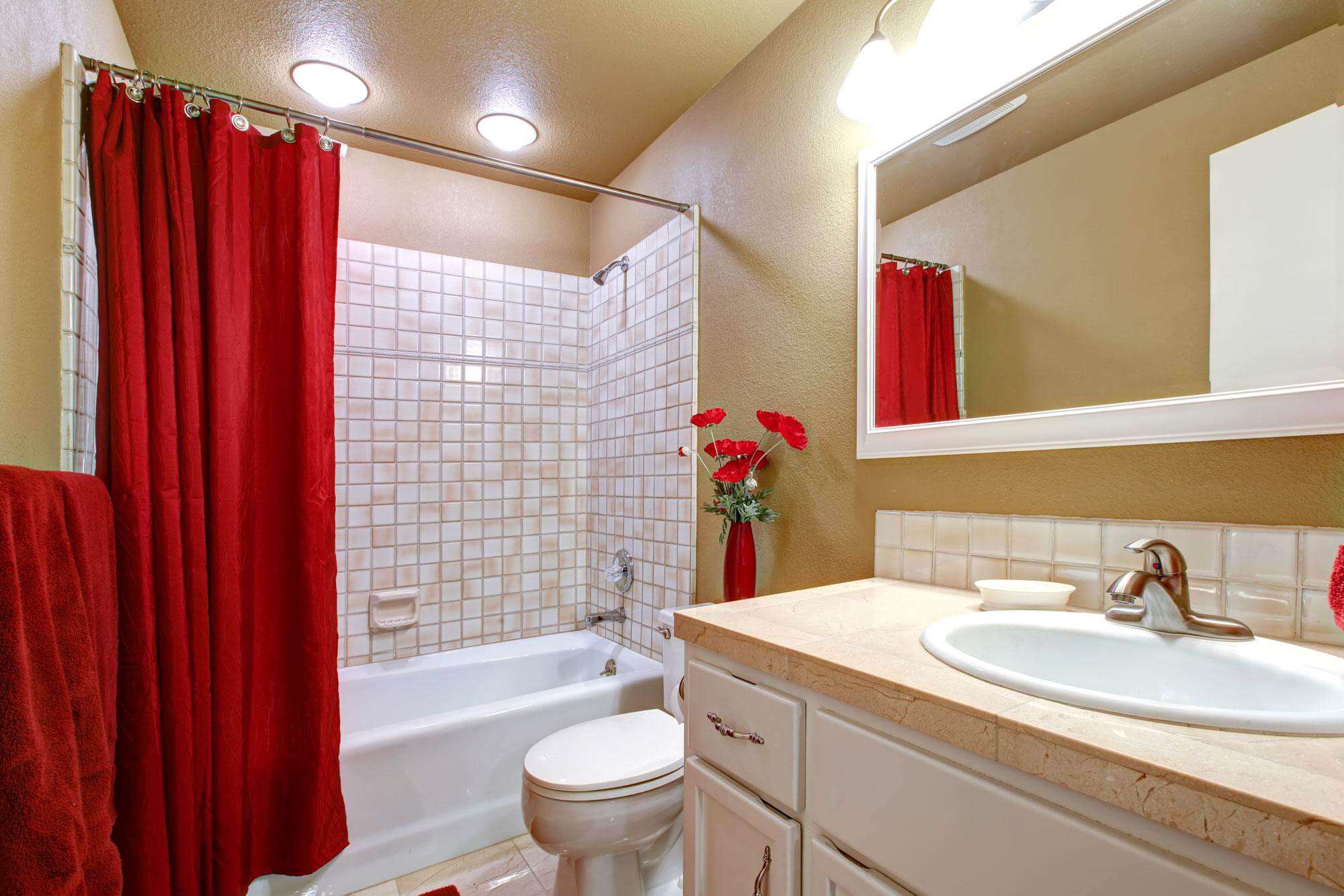 Clean and sparkling bathroom sink, toilet and shower tub