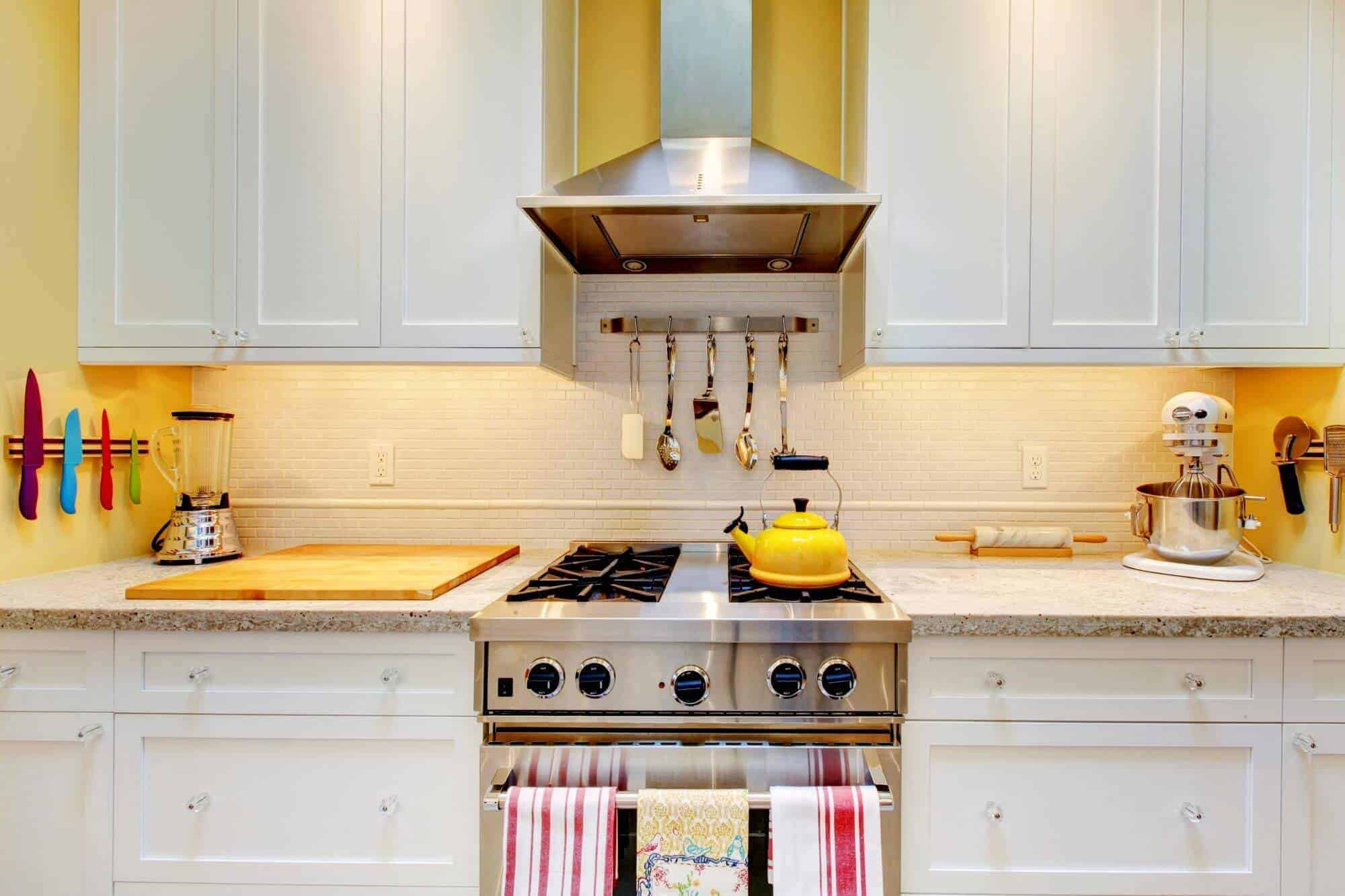 Sparking yellow and white kitchen stoves oven and countertop